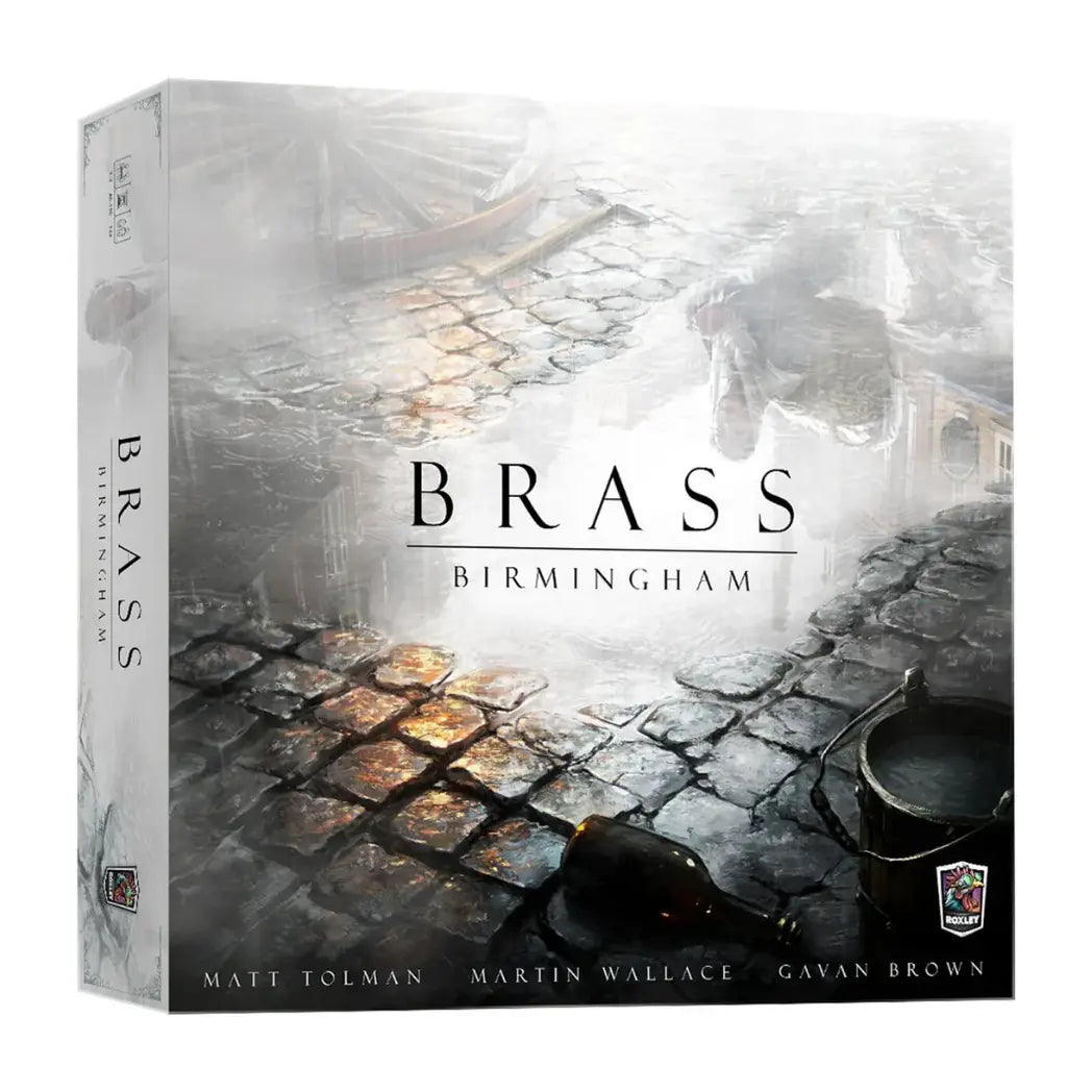 Brass Birmingham board game box featuring a misty, cobblestone street with a discarded glass bottle and wooden bucket.