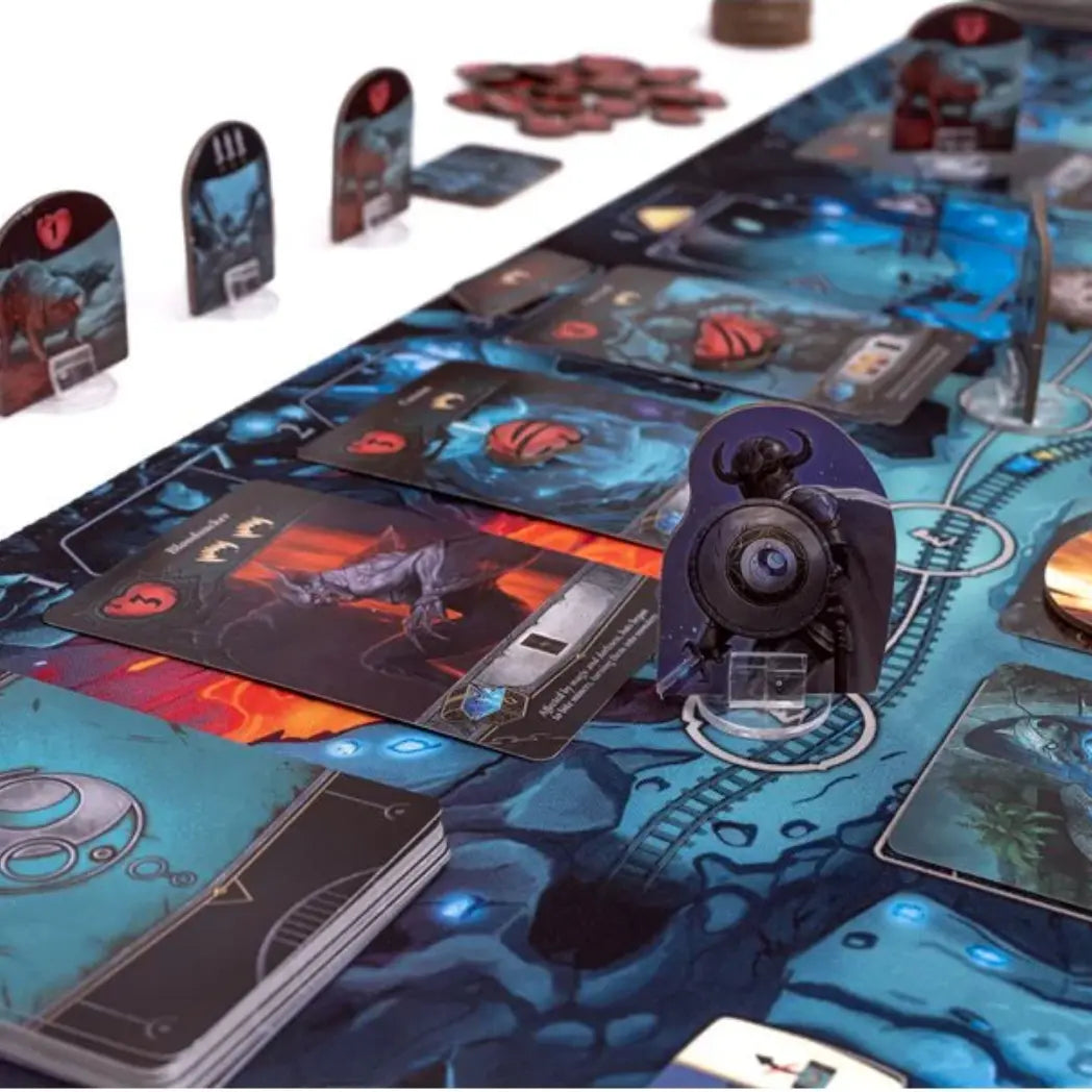 Dungeon Legends board game close-up featuring monster standees and adventure cards on a dark blue dungeon map board.