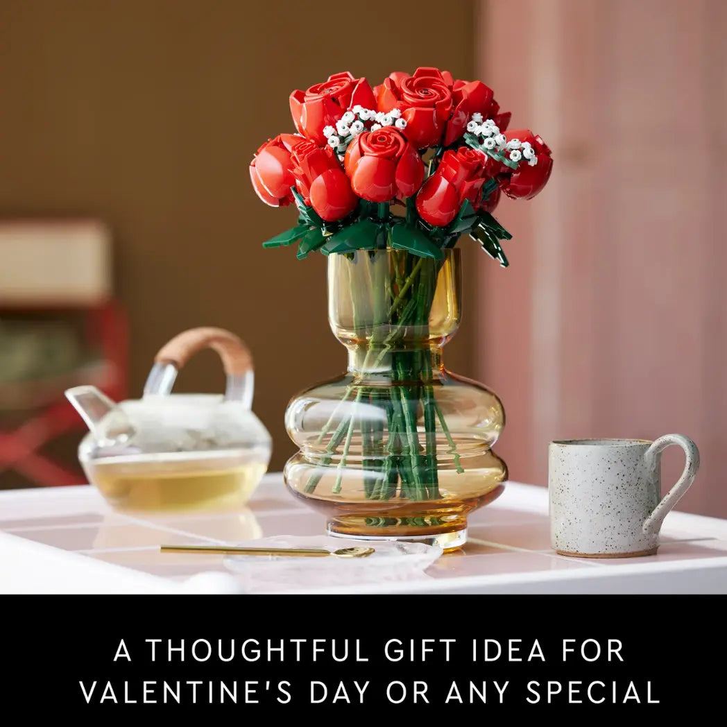 LEGO Bouquet of Roses in an amber vase on a table with a teapot and a black text banner below saying A thoughtful gift idea for valentines day or any special.