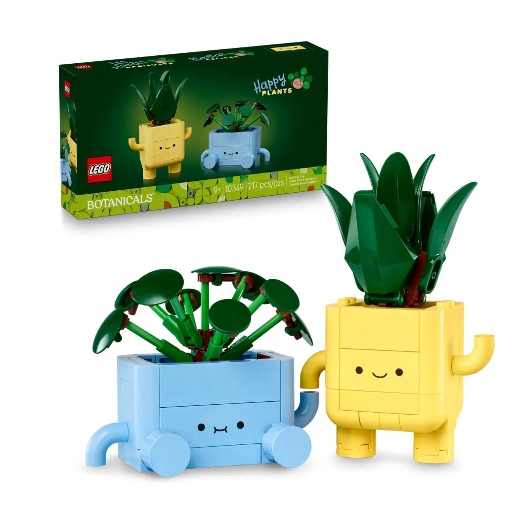 Lego Botanicals Happy Plants set with two buildable potted plants featuring cute faces in yellow and blue pots and the box behind them.