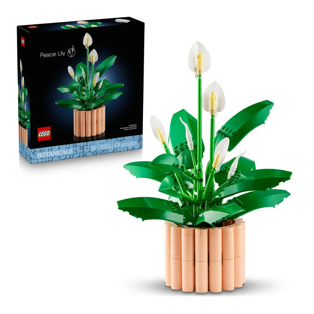 LEGO Peace Lily model and its packaging featuring white spathes and green leaves in a tan ribbed pot.