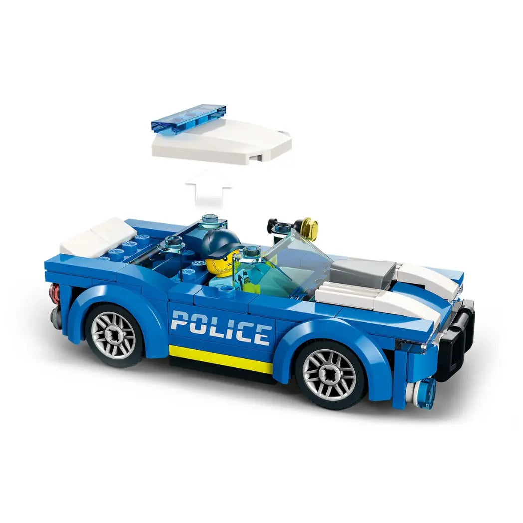 LEGO City Police Car shown from the side with the roof piece detached, revealing the police officer minifigure inside.