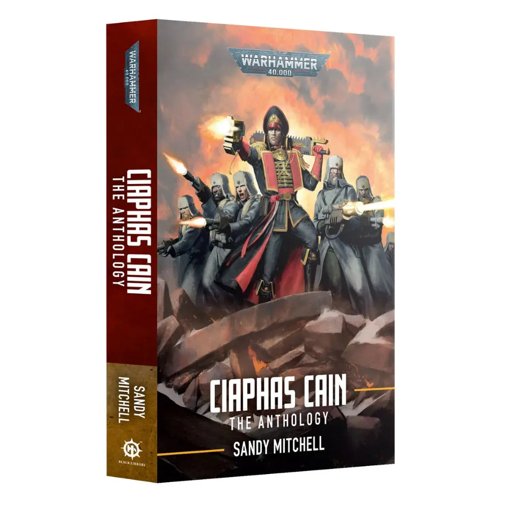 Warhammer 40k Ciaphas Cain The Anthology paperback book featuring a commissar in a black and red uniform leading soldiers in winter gear.