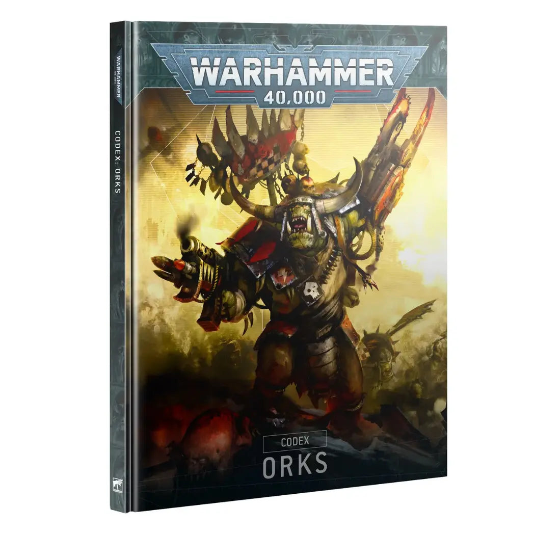 Warhammer 40k Orks Codex book featuring a large green-skinned Ork Warboss with massive horns and a mechanical claw on a yellow background.