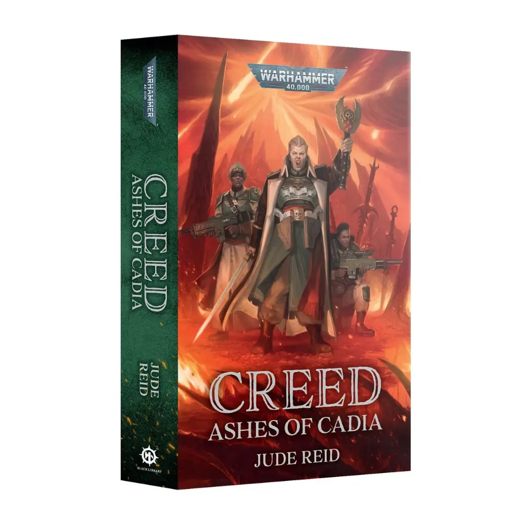 Warhammer 40k Creed Ashes of Cadia paperback book featuring a female officer in green armor and a grey coat on a dark green background.